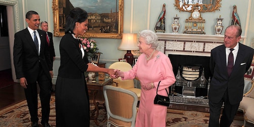 'Yikes! Sorry, guys': Michelle Obama apologizes for breaking protocol by hugging the Queen