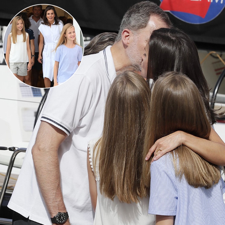Queen Letizia and daughters cover King Felipe in kisses as they kick off Mallorca vacation