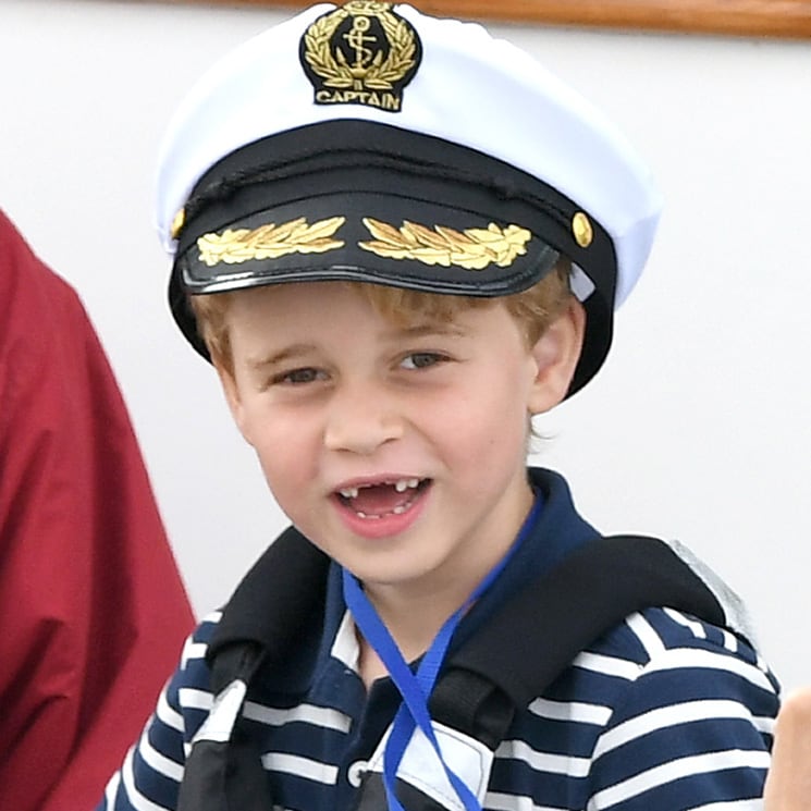 'Sailor' Prince George shows off his missing front teeth