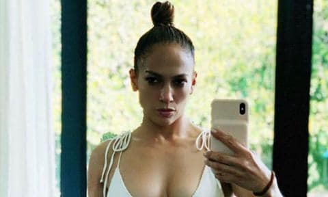 Jennifer Lopez posing in white bikini
