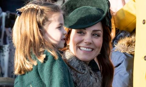 Kate Middleton posing iwth Princess Charlotte during Christmas service