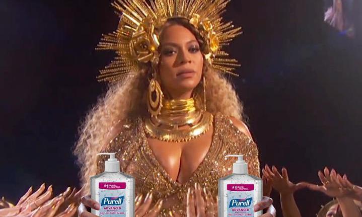 Beyonce holding two bottles of hand sanitizer