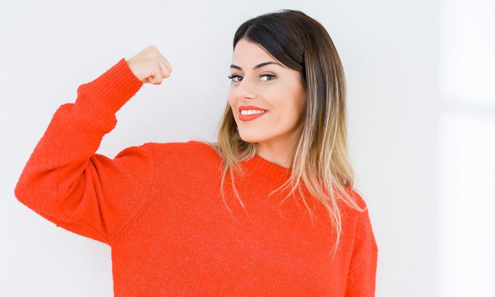 A healthy woman in a red sweater