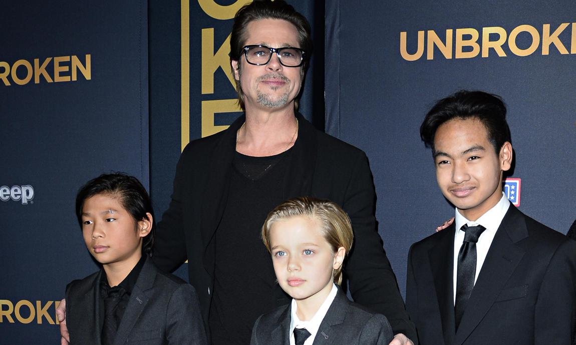 Brad Pitt posing with children Shiloh, Pax and Maddox