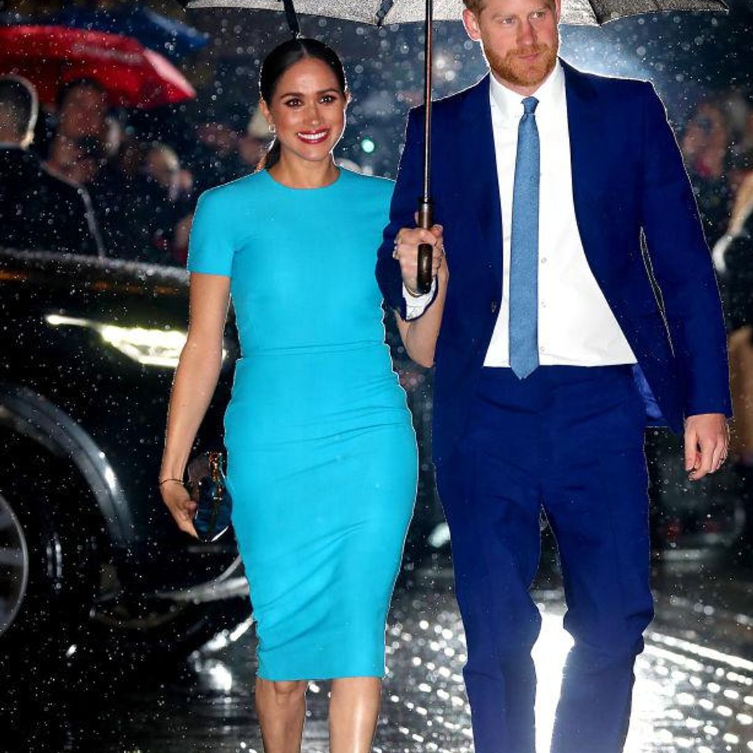 Meghan Markle wearing a turquoise Victoria Beckham dress with Prince Harry in 2020