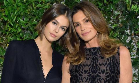 Kaia Gerber in black and Cindy Crawford in an embroidered dress