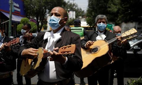 A mariachi band delivers a serenade for the medical staff of the National Institute of Respiratory Diseases