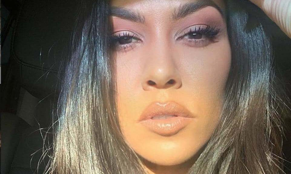Close-up selfie of Kourtney Kardashian with shiny hair
