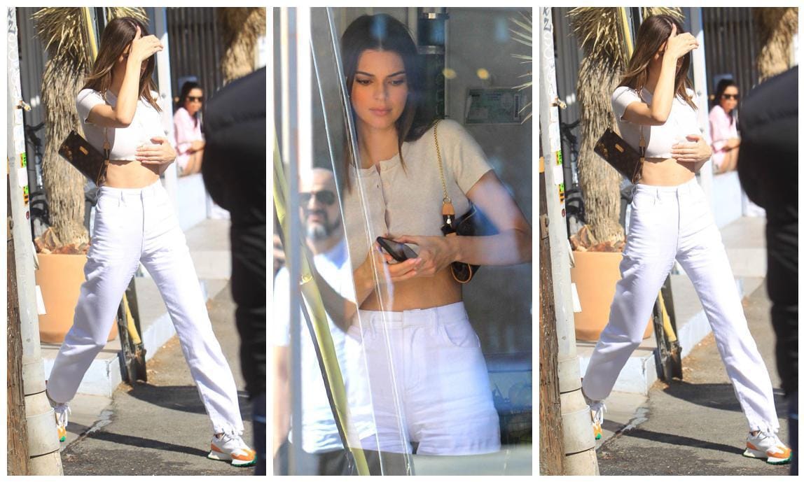 Kendall Jenner in white jeans crop top and Casablanca x New Balance Sneakers