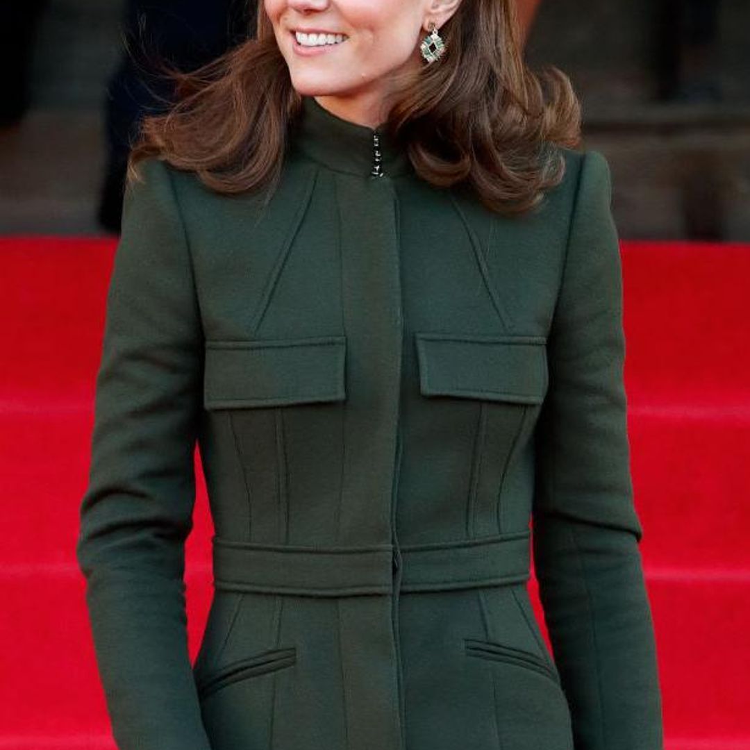 Kate Middleton wearing a dark green coat dress