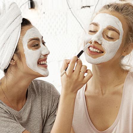 Women putting on a face mask