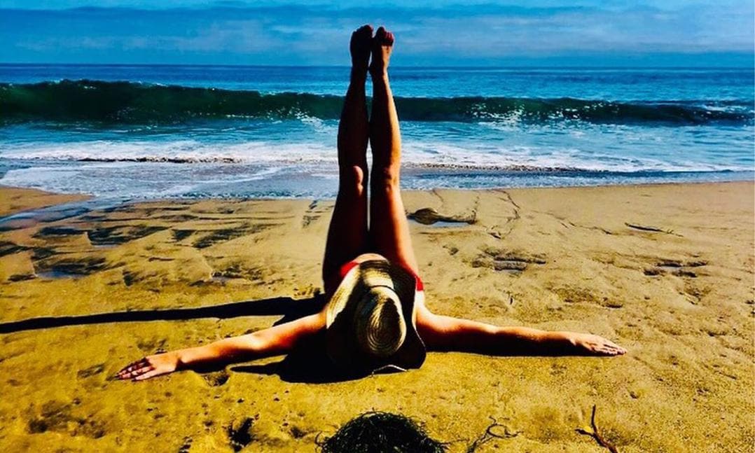 Britney Spears stretching on the beach