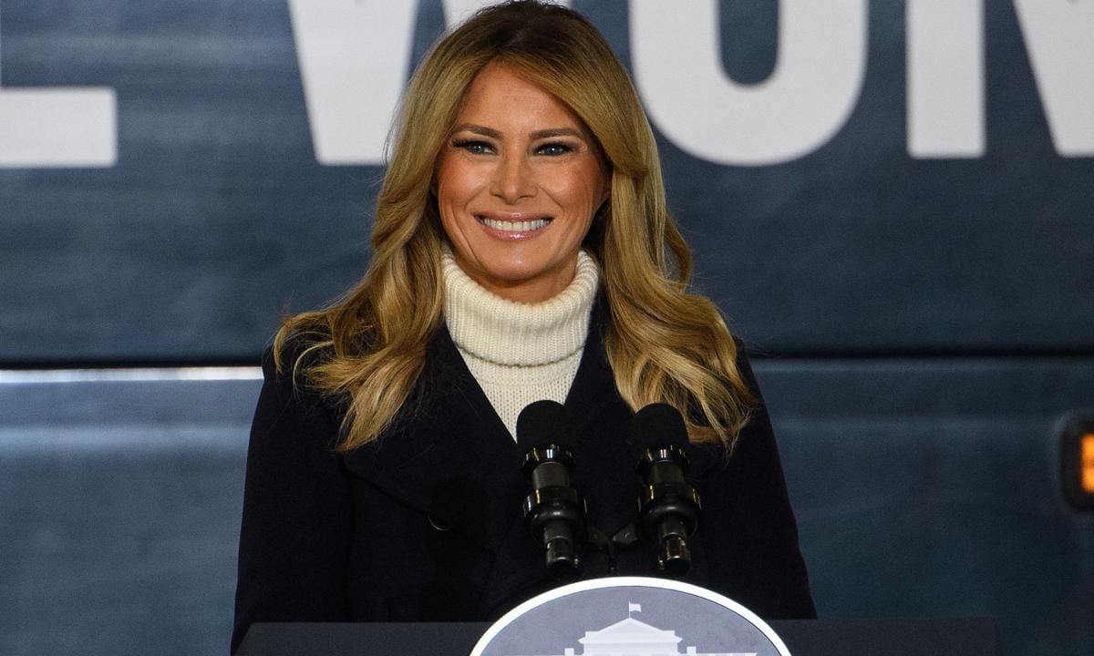 First Lady Melania Trump spreads holiday cheer wearing festive heels!