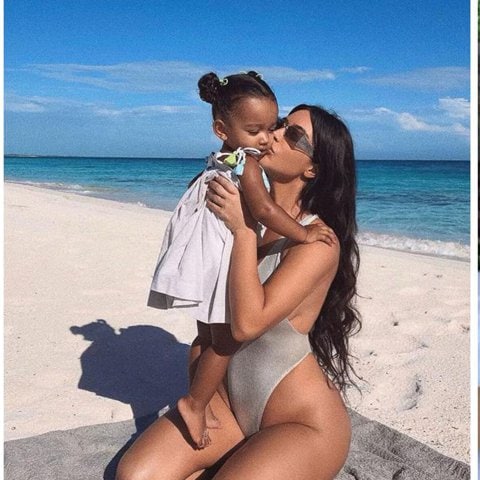 Kim Kardashian in a bathing suit carrying Chicago West at the beach.
