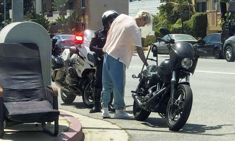 Machine Gun Kelly and Megan Fox get pulled over on a motorcycle