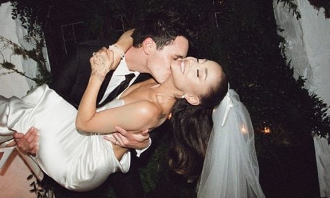 Ariana Grande and Dalton Gomez kiss at their wedding