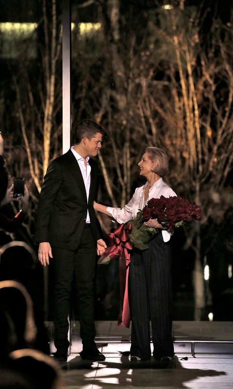 Carolina Herrera Accepts a Bouquet of Roses from Wes Gordon, the Newly Appointed Designer for the Carolina Herrera Label.