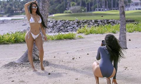 Kim Kardashian Poses in a Silver Bikini to Promote her New SKIMS swimsuit line