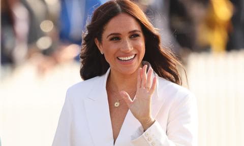 Meghan Markle rocks white pantsuit at reception in The Hague