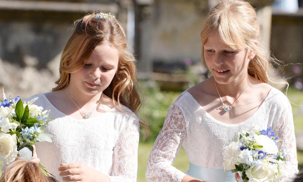 Queen Elizabeth’s great-granddaughters are adorable bridesmaids at family wedding